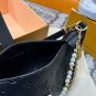 P125 gift box packagingLV Pochette Mia handbag from Louis Vuitton, featuring classic Mon