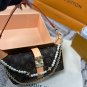 P125 gift box packagingLV Pochette Mia handbag from Louis Vuitton, featuring classic Mon_583