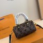 p125LV Speedy glitter limited edition pillow bag. This Retiro handbag is made of iconic