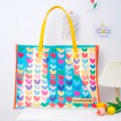 Small heart-shaped, colorful, laser-cut hand-held jelly bag