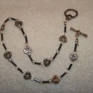 Black beads with silver toned hearts anklet