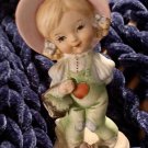 NORLEANS Figurine Girl carrying basket in heart overalls