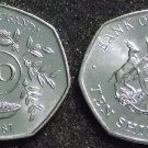 1987 Uganda 10 shillings-Antelope/Crane/Plant-Unusual septagon(7 side)shape-BU