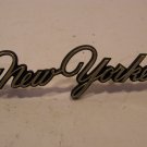 1976 77 78 CHRYSLER NEW YORKER GOLD SCRIPT EMBLEM #3569955 W/ STUDS 71 72 73 74 1976 77 78 CHRYSLER NEW YORKER GOLD SCRIPT EMBLEM #3569955 W/ STUDS 71 72 73 74