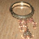 silver bracelet with pink beeds