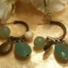 Brass set earrings with dangling natural colored gems-82289