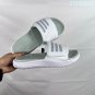 Collection 85 Adilette Alpha slippers, classic black and white color scheme+three