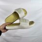 Collection 85 Adilette Alpha slippers, classic black and white color scheme+three