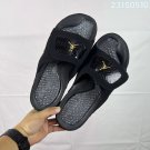 ninety-five Hydro 12 slippers, made of white synthetic leather and gold Flyman log