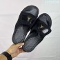 ninety-five Hydro 12 slippers, made of white synthetic leather and gold Flyman log