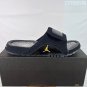 ninety-five Hydro 12 slippers, made of white synthetic leather and gold Flyman log