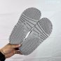 ninety-five Hydro 12 slippers, made of white synthetic leather and gold Flyman log_3895