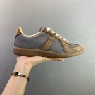 one hundred and fiftyMaison Margiela training shoesThe top layer of the shoe is made o