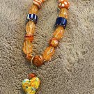 Orange Bracelet With Heart Charm And Unique Beads
