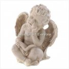 READING CHERUB FIGURINE