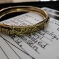 The Walking Dead Original Production Used Daryl Scavenged Gold Bracelet Prop