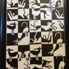 Black and white playful Greyhounds