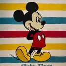 Mickey Mouse with colored stripes in background