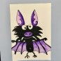 Purple winged bat