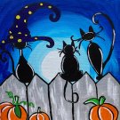 The witches’ cats on the fence