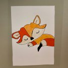 Sleeping baby fox