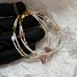 Delicate double layer bracelet made of natural freshwater millet pearls and strawberry quartz
