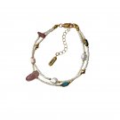 Delicate double layer bracelet made of natural freshwater millet pearls and strawberry quartz Delicate double layer bracelet made of natural freshwater millet pearls and strawberry quartz