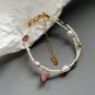 Delicate double layer bracelet made of natural freshwater millet pearls and strawberry quartz