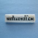 Vintage Minolta nameplate from srt models case