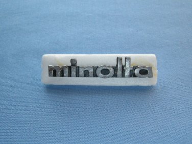 Vintage Minolta nameplate from srt models case