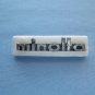 Vintage Minolta nameplate from srt models case