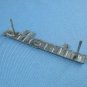 Vintage Minolta nameplate from srt models case