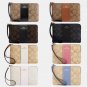 COACH Corner Zip Wristlet Canvas Signature Women's Wallet (Black)