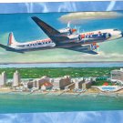 Eastern Airlines Golden Falcon DC - 7B Postcard Plane In Sky Flying Ca. 1950s Eastern Airlines Golden Falcon DC - 7B Postcard Plane In Sky Flying Ca. 1950s