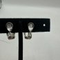 Vintage NWH Silver Clip-On Earrings With Rhinestone Accents