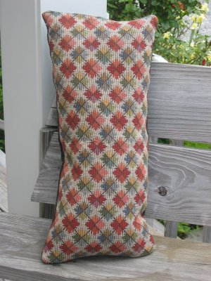 Multi coloured geometric pillow