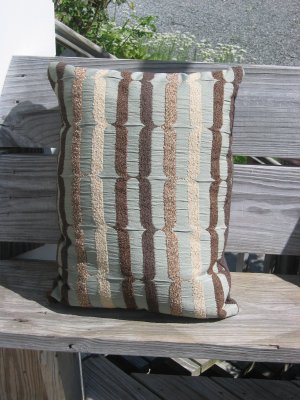 pale blue, beige and brown pillow
