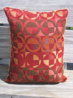 Red and mustard circle pillow