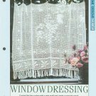 Crochet pattern for filet net curtain with a central vine motif and leaf border