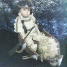 indian doll in a canoe