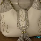 Charm and Luck pebbled leather designer handbag.