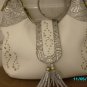 Charm and Luck pebbled leather designer handbag.