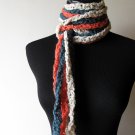 the twisted colors scarf in teal, cream, and mango.