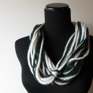 the big knot scarf in cream and green.