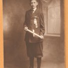 A PROUD GRADUATE DRESSED IN HIS SUNDAY BEST KNICKERS HIGH TOP SHOES