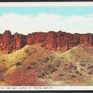 The Badlands of North Dakota White Border Postcard 257