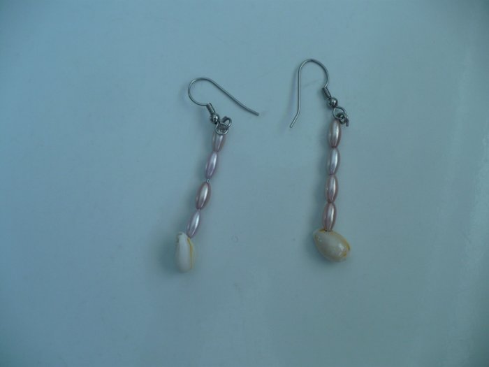 earrings made with light pink pearl like beads and small cowrie shells