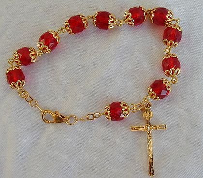 Red glass beads bracelet with golden cross