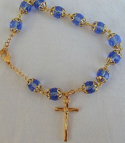 Light blue glass beads bracelet with golden cross