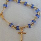Light blue glass beads bracelet with golden cross Light blue glass beads bracelet with golden cross